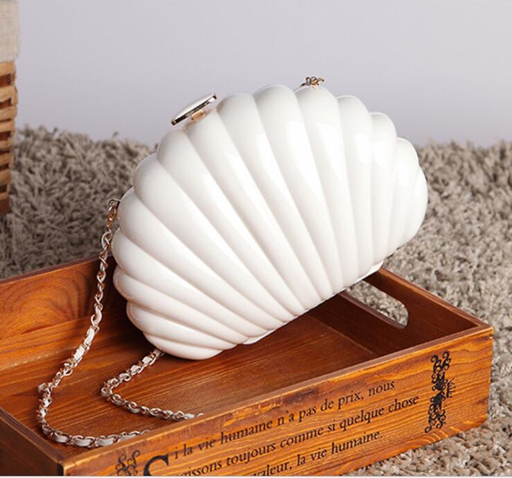 High Quality Exquisite Shell Evening Bag in elegant design, perfect for evening events, showcasing its stylish shell shape and shoulder strap.