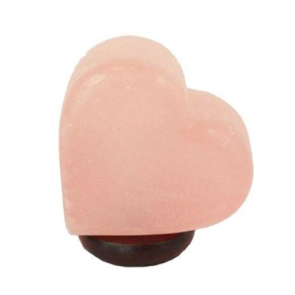 Himalayan Pink Salt Lamp in heart shape, glowing softly, showcasing its natural carved texture and warm light.