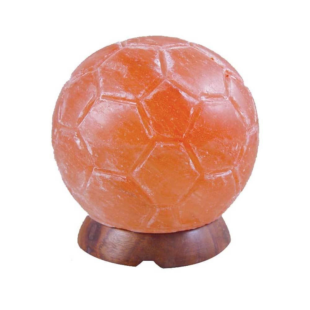 A beautifully carved Himalayan Pink Salt Lamp emitting a warm glow, showcasing its unique shape and natural texture.