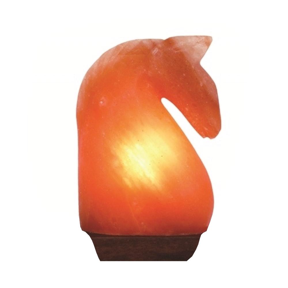 A beautifully carved Himalayan Pink Salt Lamp emitting a warm glow, showcasing its unique shape and natural texture.