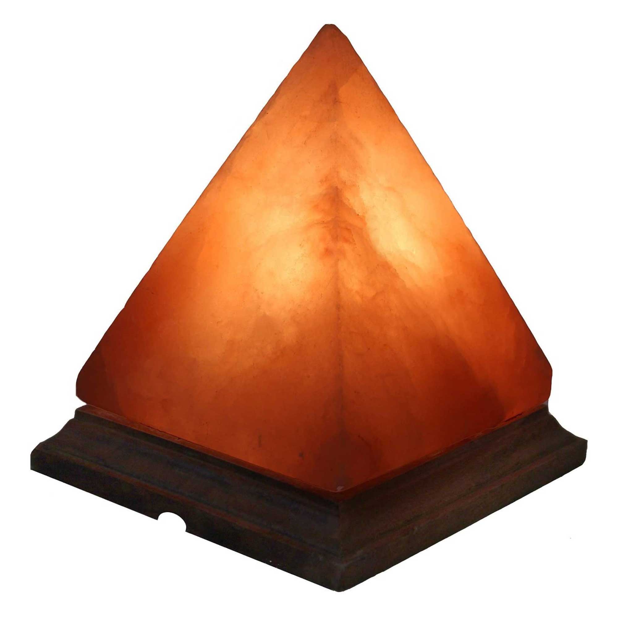 A beautifully carved Himalayan Pink Salt Lamp emitting a warm glow, showcasing its unique shape and natural texture.