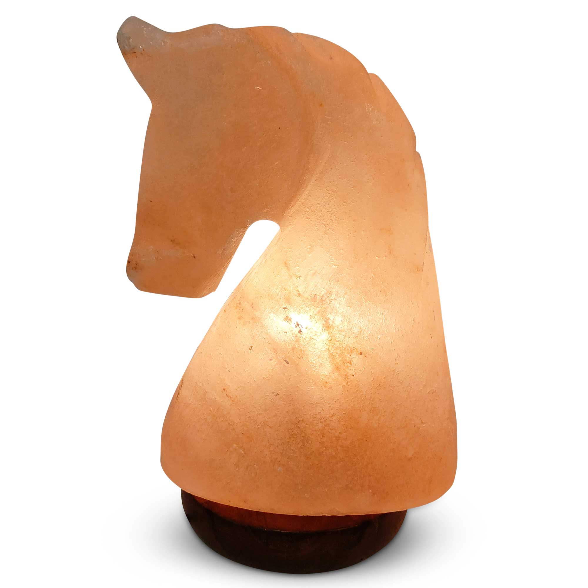 A beautifully carved Himalayan Pink Salt Lamp emitting a warm glow, showcasing its unique shape and natural texture.