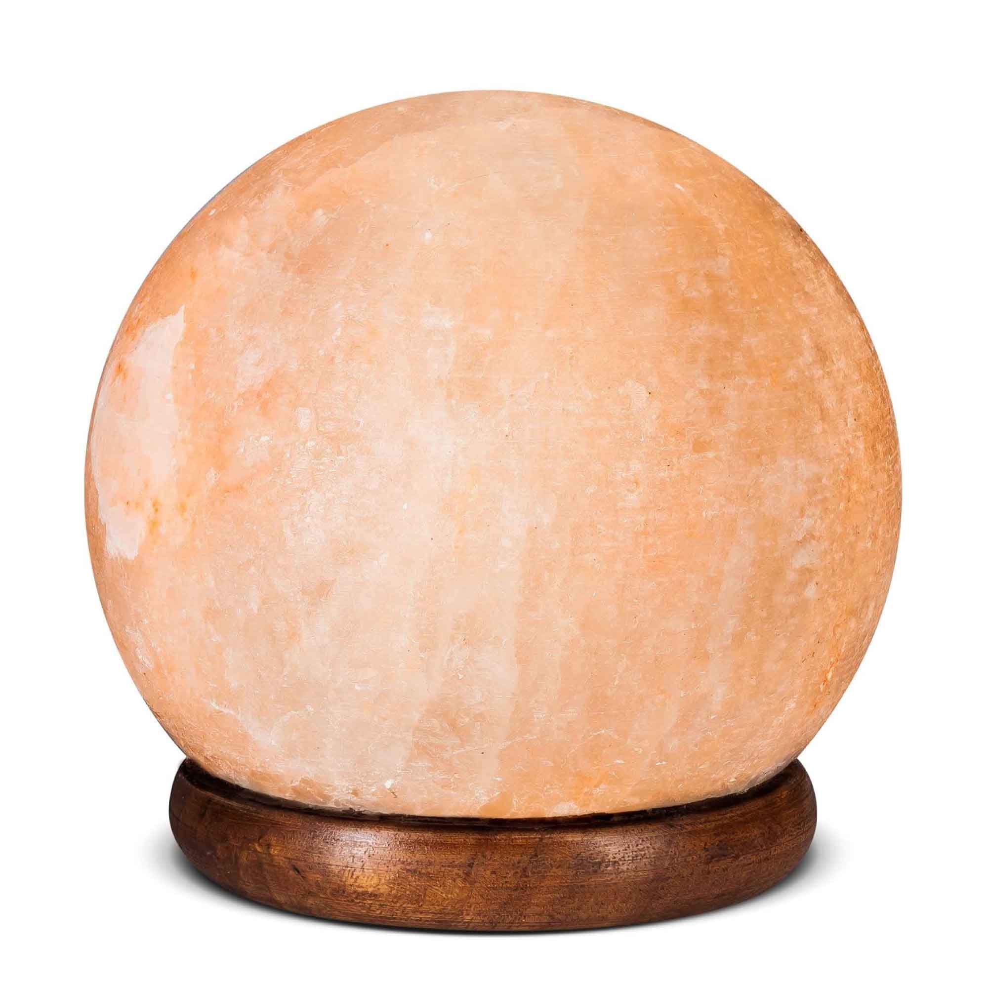 A beautifully carved Himalayan Pink Salt Lamp emitting a warm glow, showcasing its unique shape and natural texture.