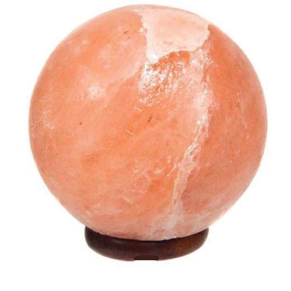 A beautifully carved Himalayan Pink Salt Lamp emitting a warm glow, showcasing its unique shape and natural texture.