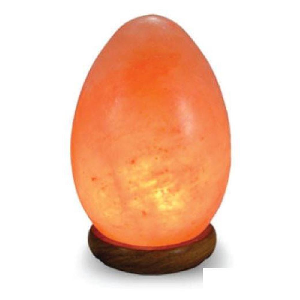 A beautifully carved Himalayan Pink Salt Lamp emitting a warm glow, showcasing its unique shape and natural texture.