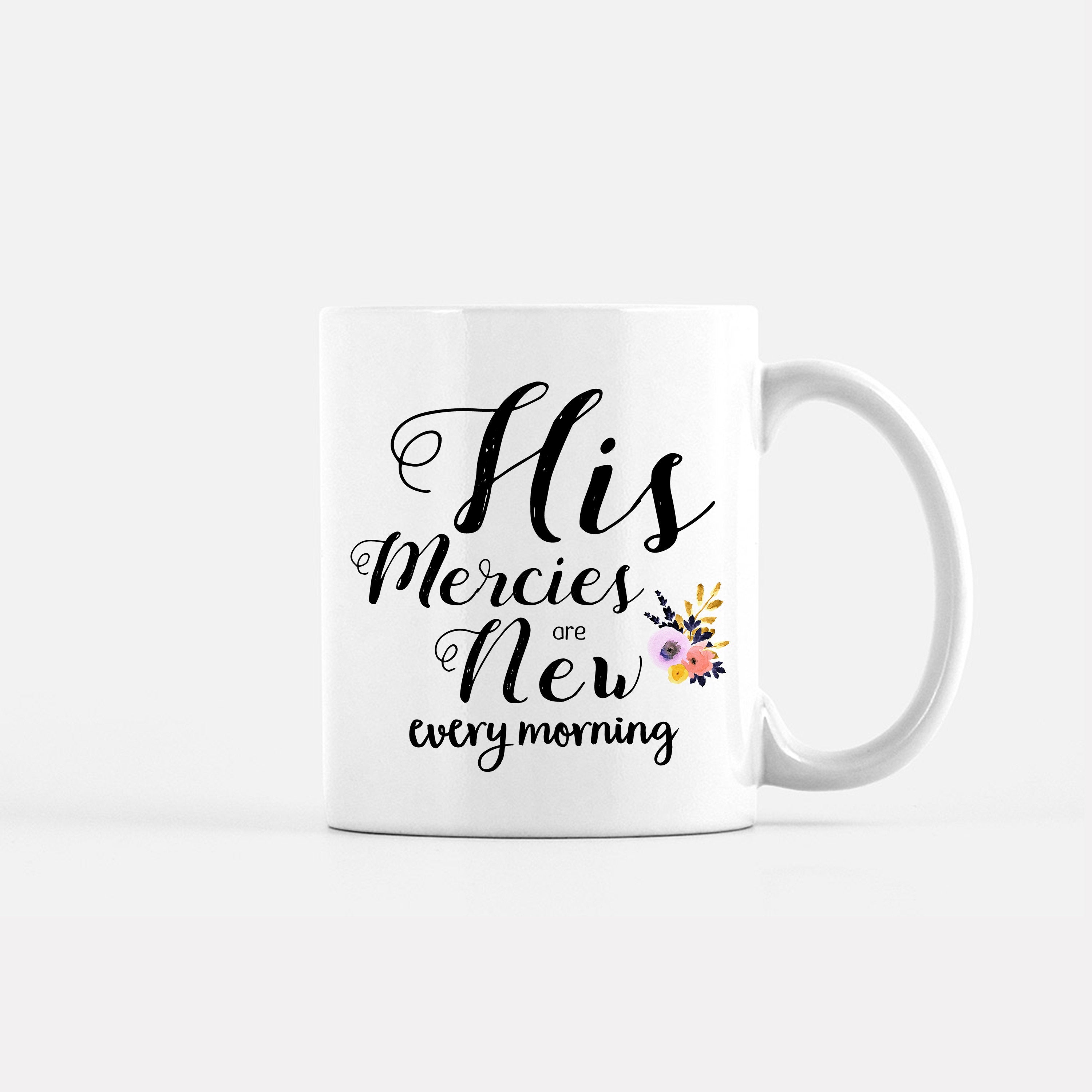 White coffee mug with hand-lettered scripture 'His Mercies are New Every Morning' printed on both sides, showcasing an inspirational design.