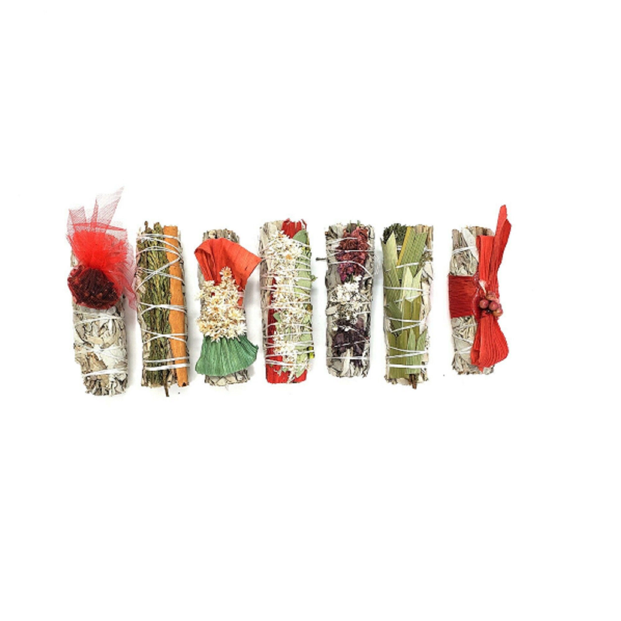 Holiday Gift Pack featuring 7 assorted 4-inch sage bundles with various herbs and flowers, beautifully arranged for gifting.