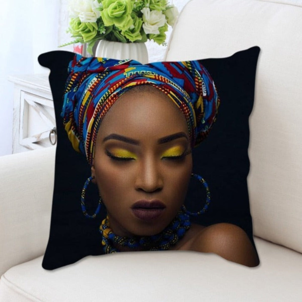 A plush cushion cover featuring a vibrant African woman portrait, showcasing cultural elegance and artistic design.