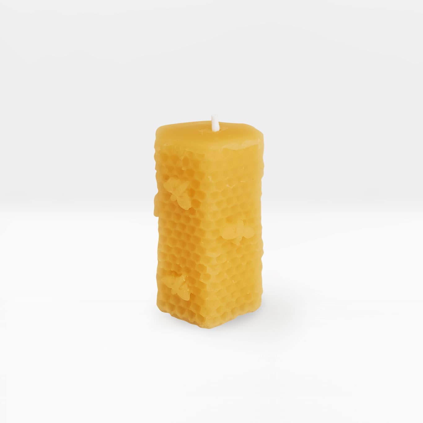 A beautifully crafted Honeycomb Candle with a unique texture, standing 3.2 inches tall, perfect for home decor.