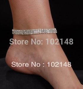 A glamorous 3-row rhinestone anklet designed for dancers and showgirls, featuring silver plating and a trendy round shape.