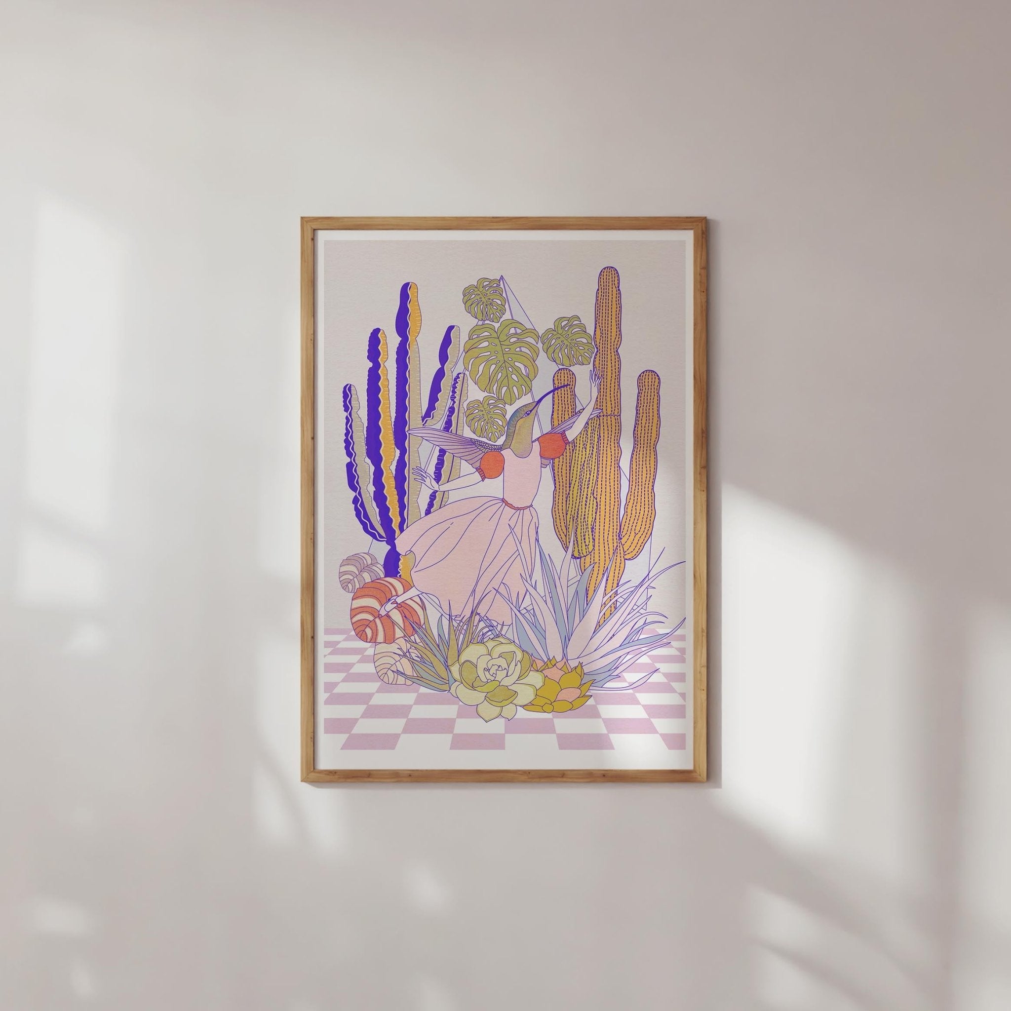 A whimsical art print featuring a half hummingbird, half lady surrounded by succulents and cacti in a terrarium.