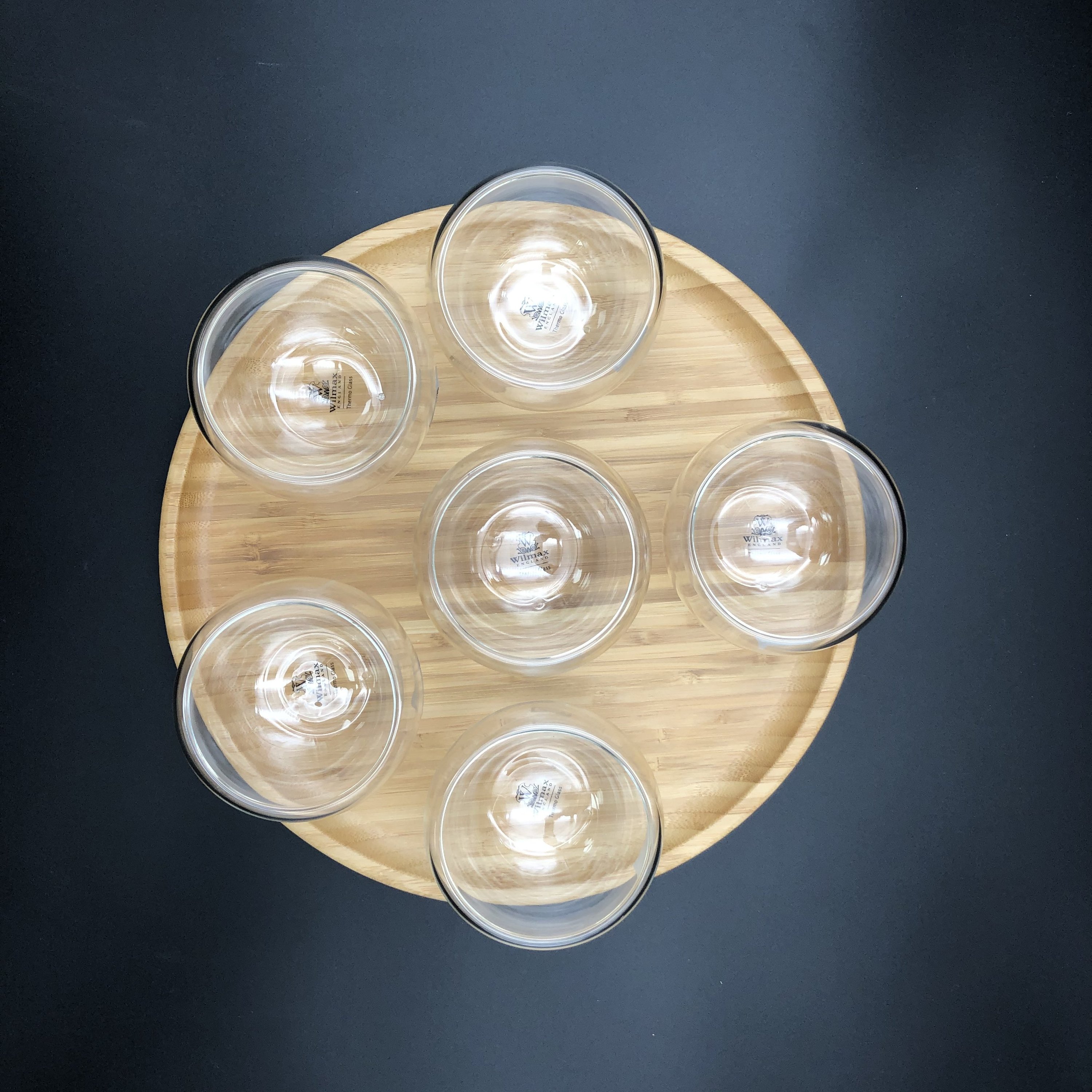 Ice-Cream Presentation Set featuring 6 double-walled bowls, stainless steel spoons, and a bamboo platter, elegantly arranged for serving desserts.