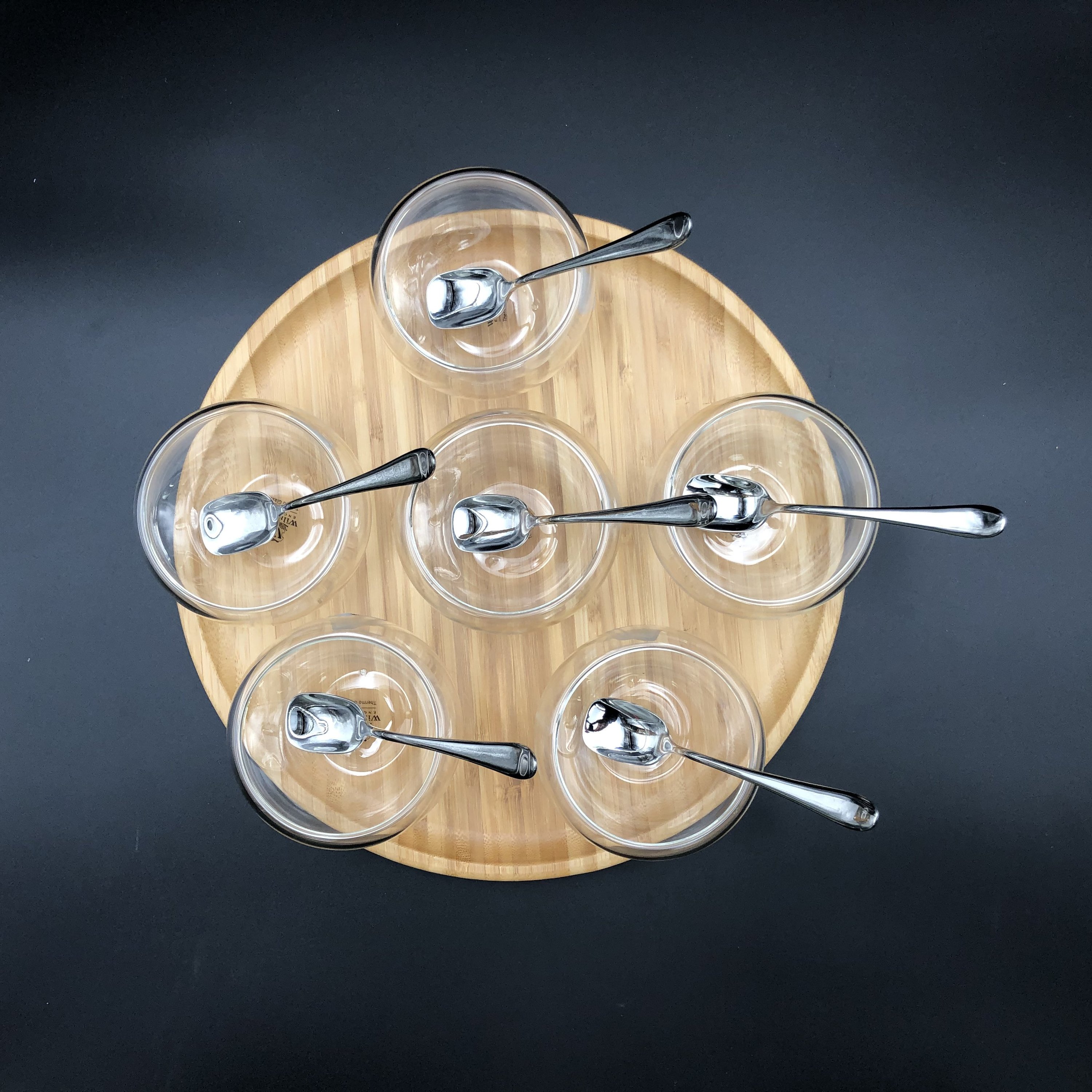 Ice-Cream Presentation Set featuring 6 double-walled bowls, stainless steel spoons, and a bamboo platter, elegantly arranged for serving desserts.