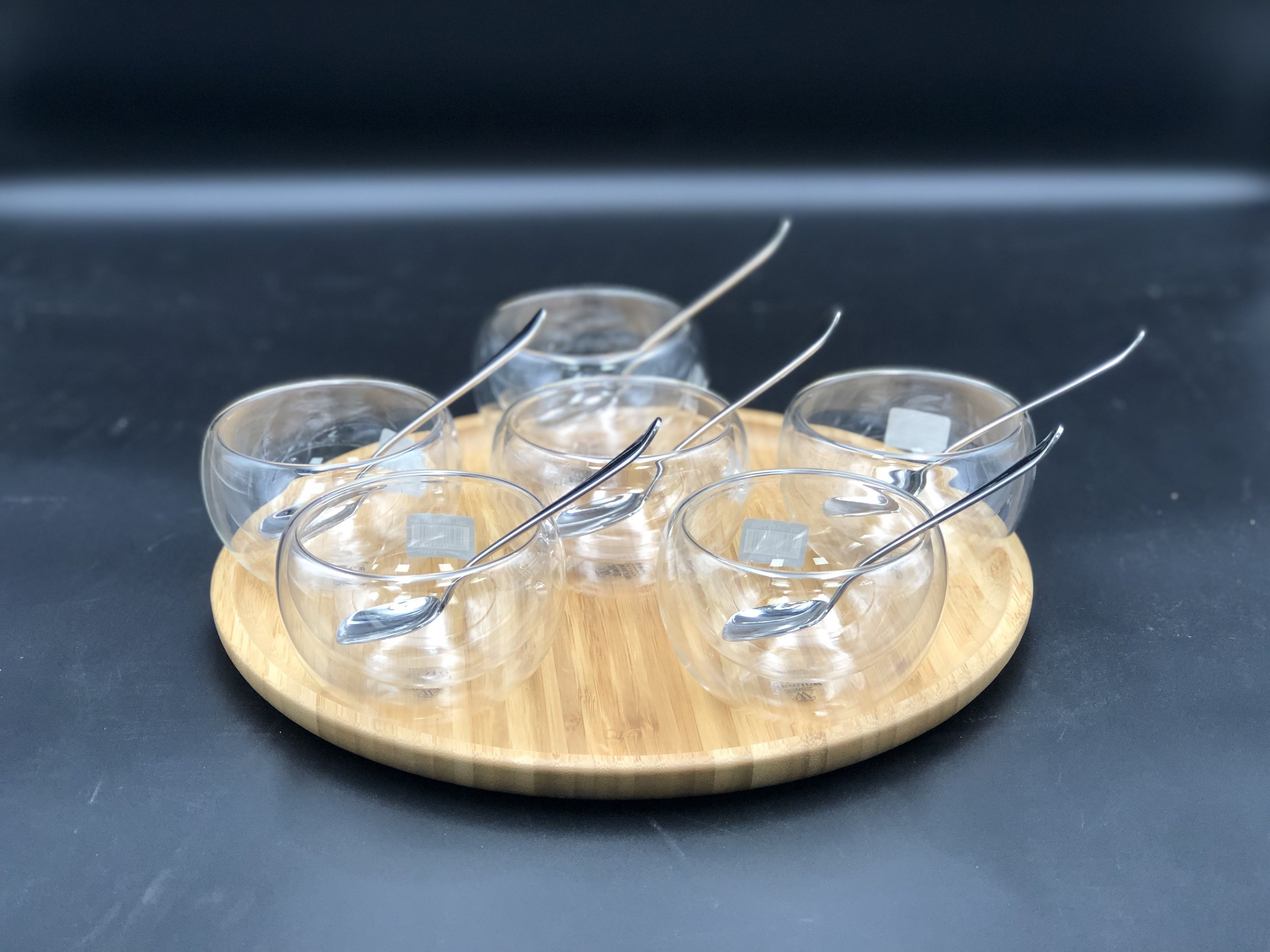 Ice-Cream Presentation Set featuring 6 double-walled bowls, stainless steel spoons, and a bamboo platter, elegantly arranged for serving desserts.