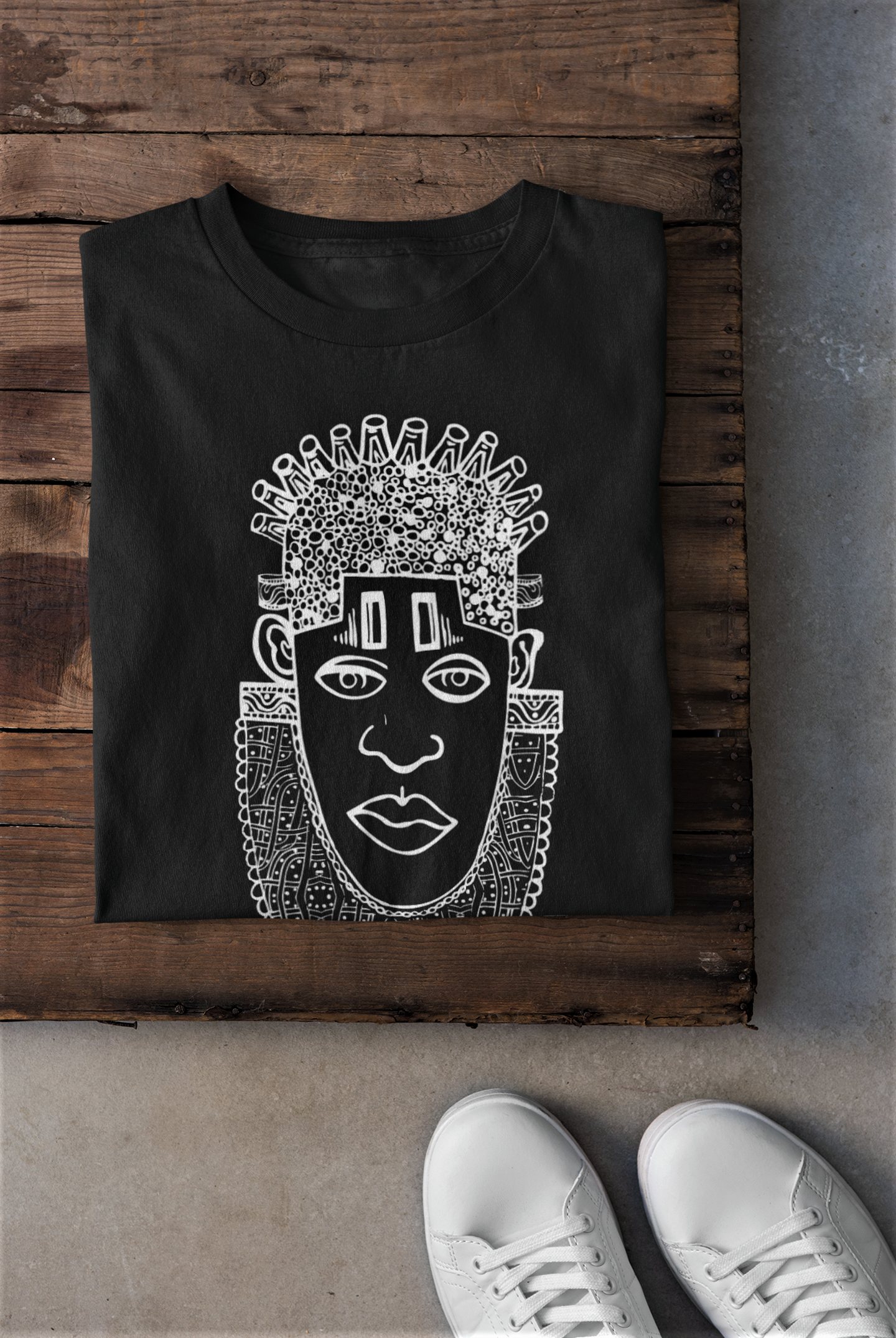 IDIA Art Earth Positive Tee featuring Queen IDIA design in white on black, made from 100% organic cotton.