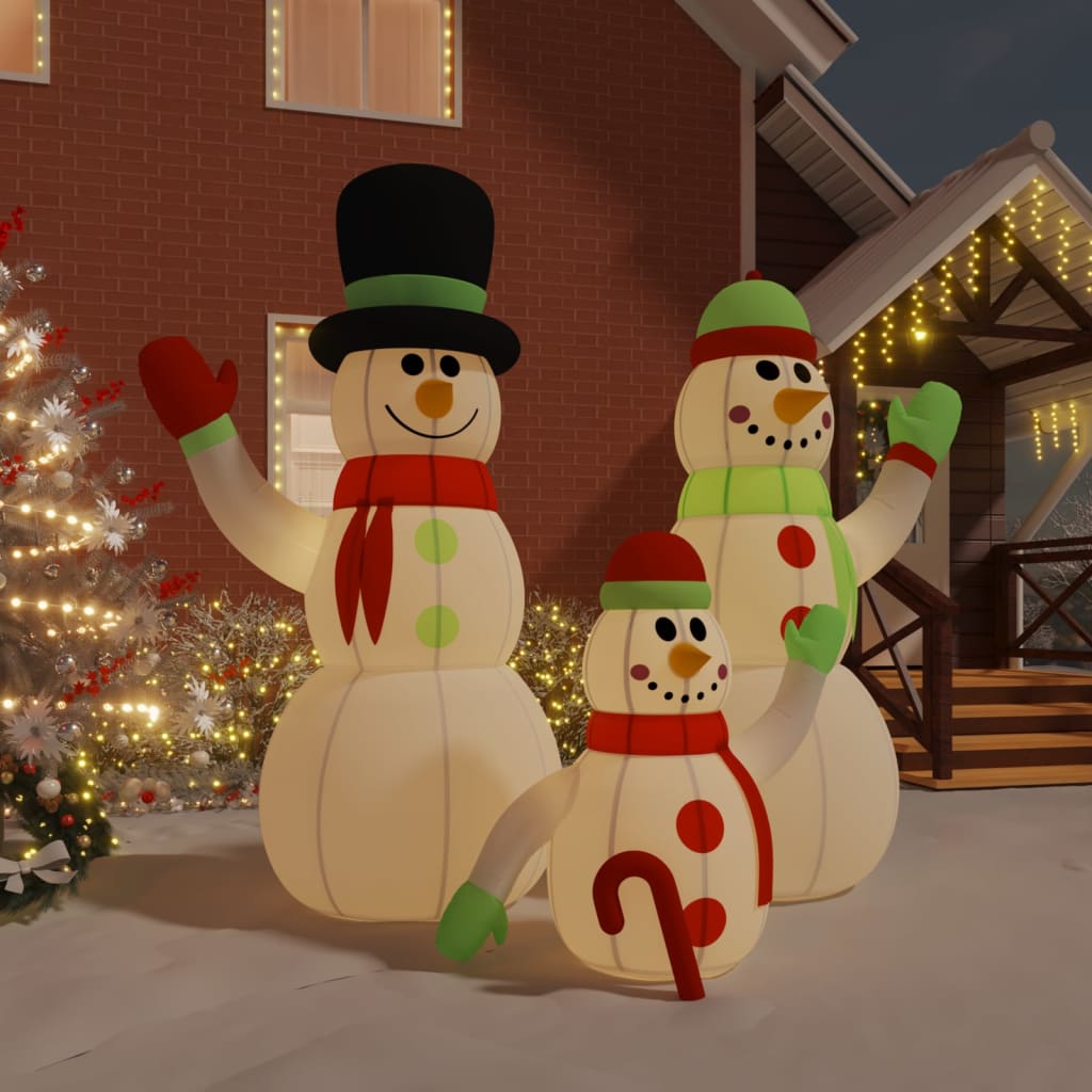 A large inflatable snowman family with LED lights, featuring three snowmen in festive attire, perfect for Christmas decoration.