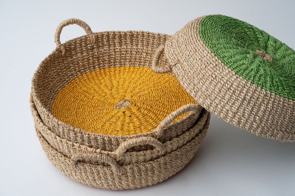 Iris Round Tray in Yellow, handwoven from natural seagrass, featuring vibrant circular colors for a stylish and functional home decor piece.