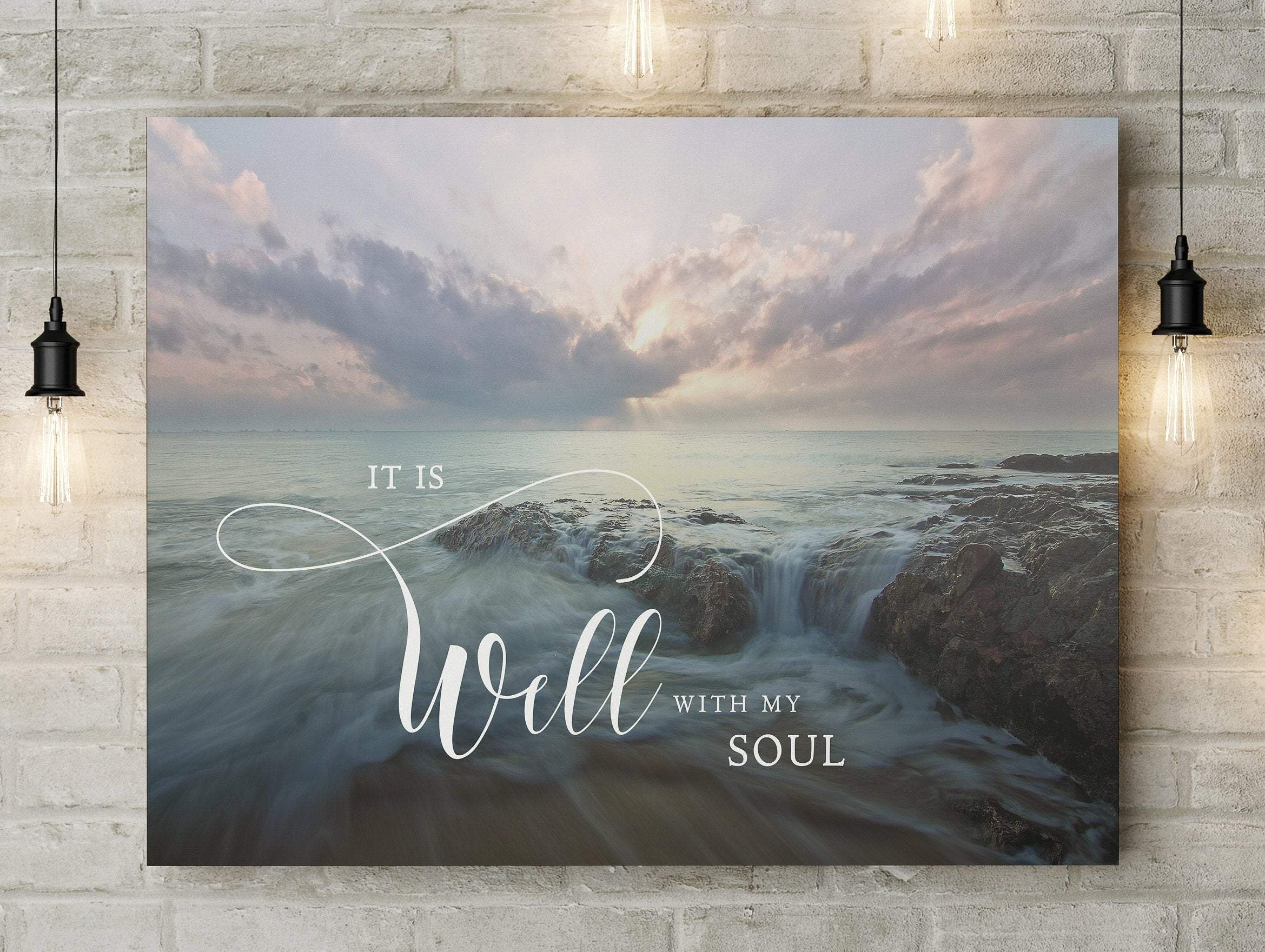 A serene canvas print featuring the quote 'It Is Well With My Soul' under a beautiful sky and peaceful waters, perfect for home decor.