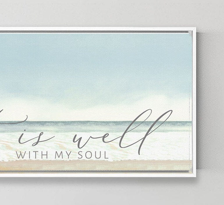 A beautiful coastal canvas wall art featuring the phrase 'It Is Well With My Soul', showcasing serene beach colors and textures.