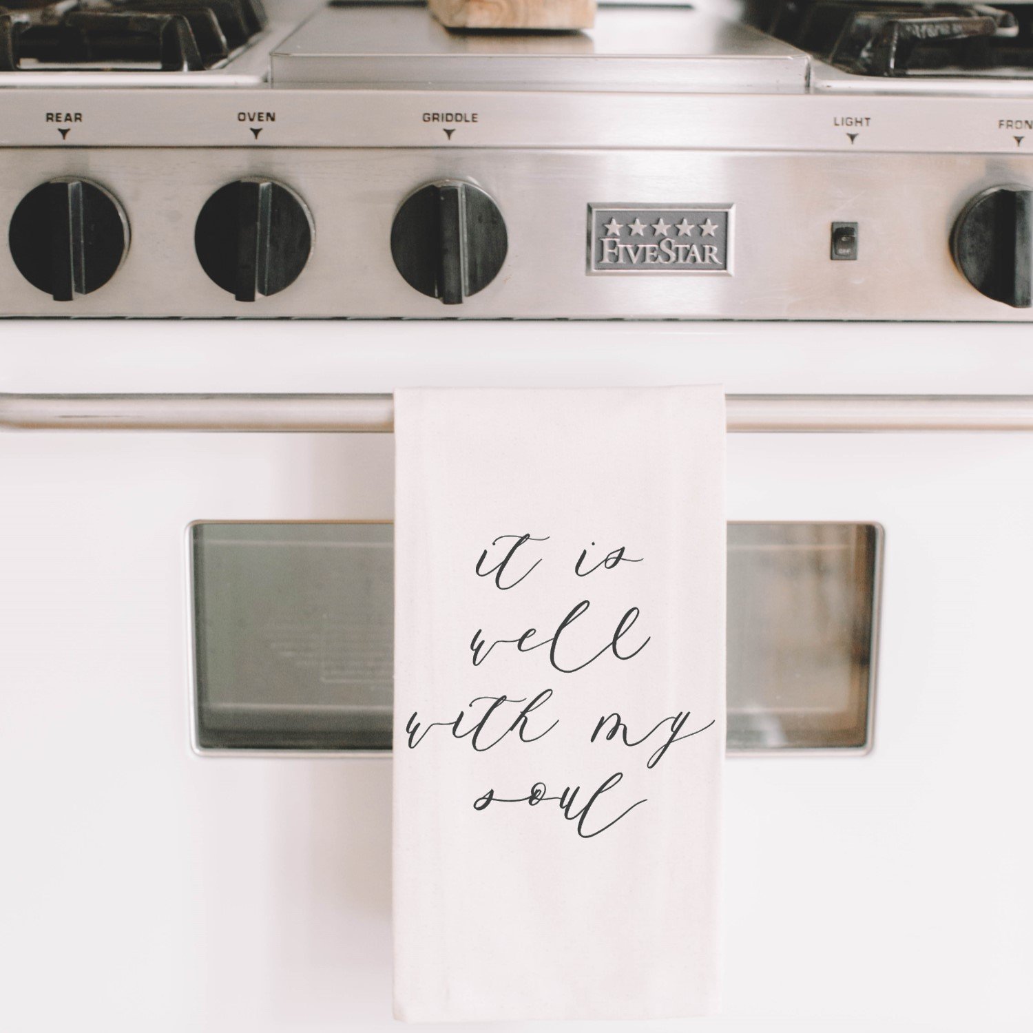 It Is Well With My Soul Kitchen Towel featuring elegant calligraphy design on organic cotton fabric, available in white and natural colors.