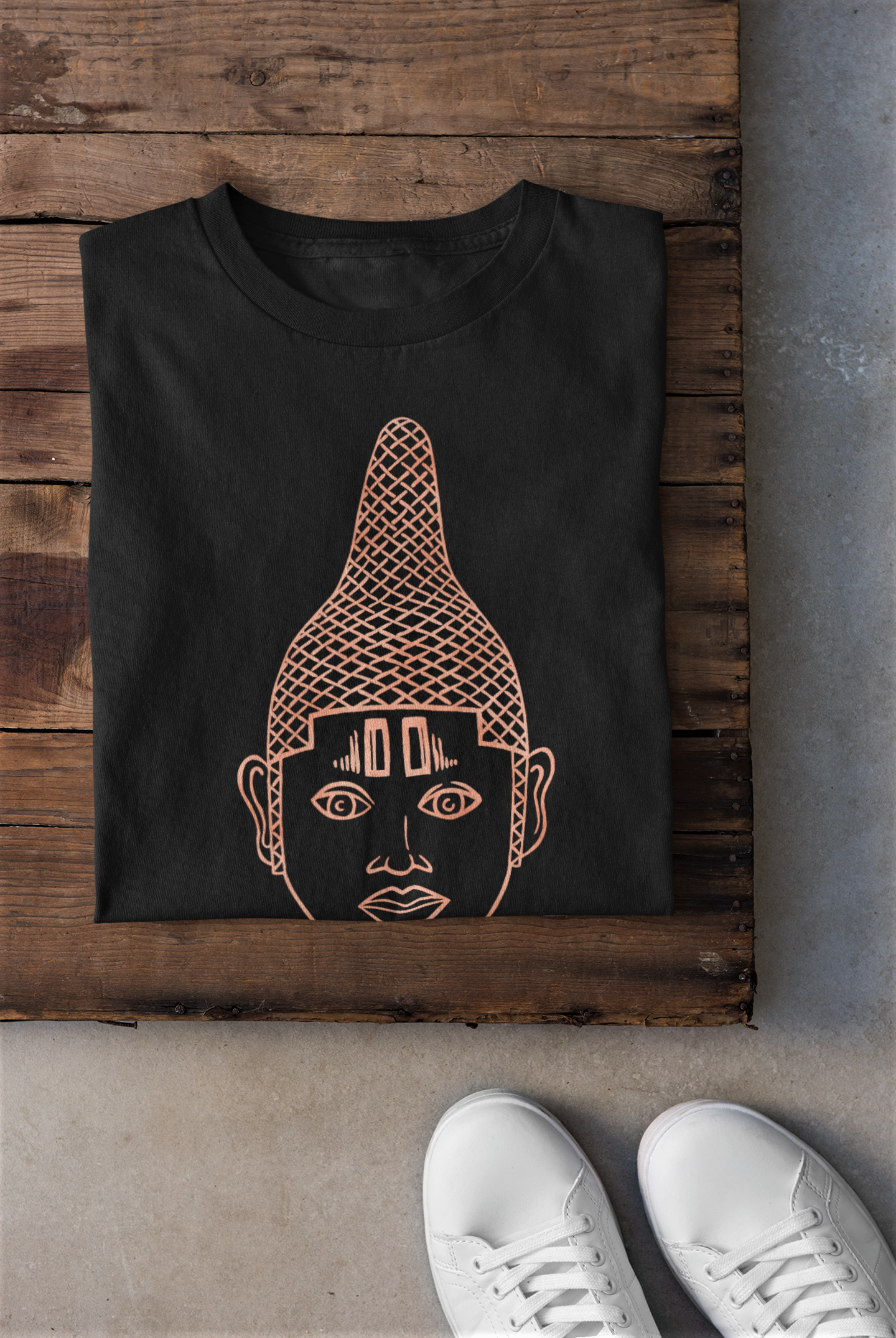 IYOBA Art Tee featuring rose-gold prints of Queen IDIA on a black background, made from 100% organic cotton.