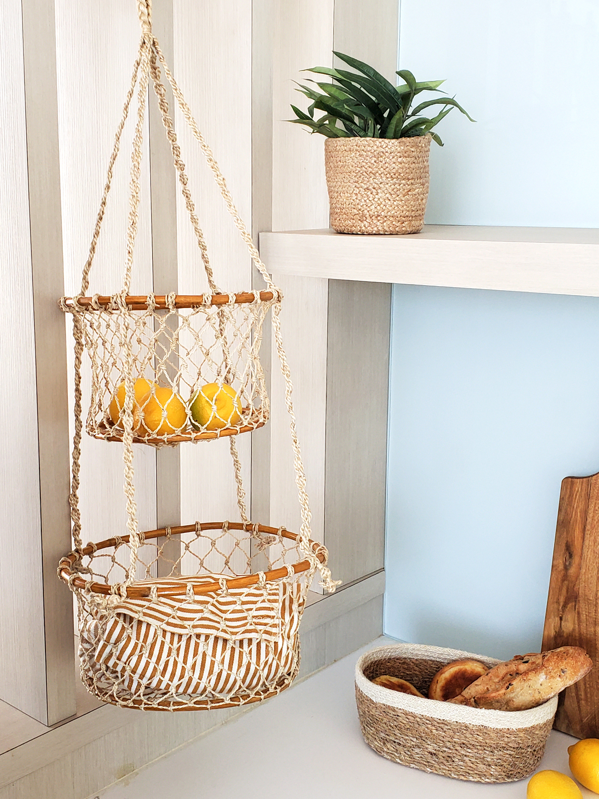 Jhuri Double Hanging Basket made from natural jute and wood, featuring two baskets for plants or storage, showcasing rustic charm.