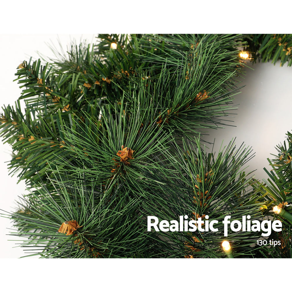 Jingle Jollys 1.8M Christmas Garland with warm LED lights, showcasing thick foliage and a festive design.