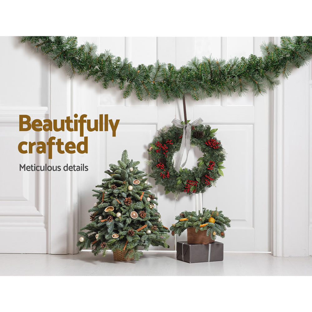 Jingle Jollys 1.8M Christmas Garland with warm LED lights, showcasing thick foliage and a festive design.