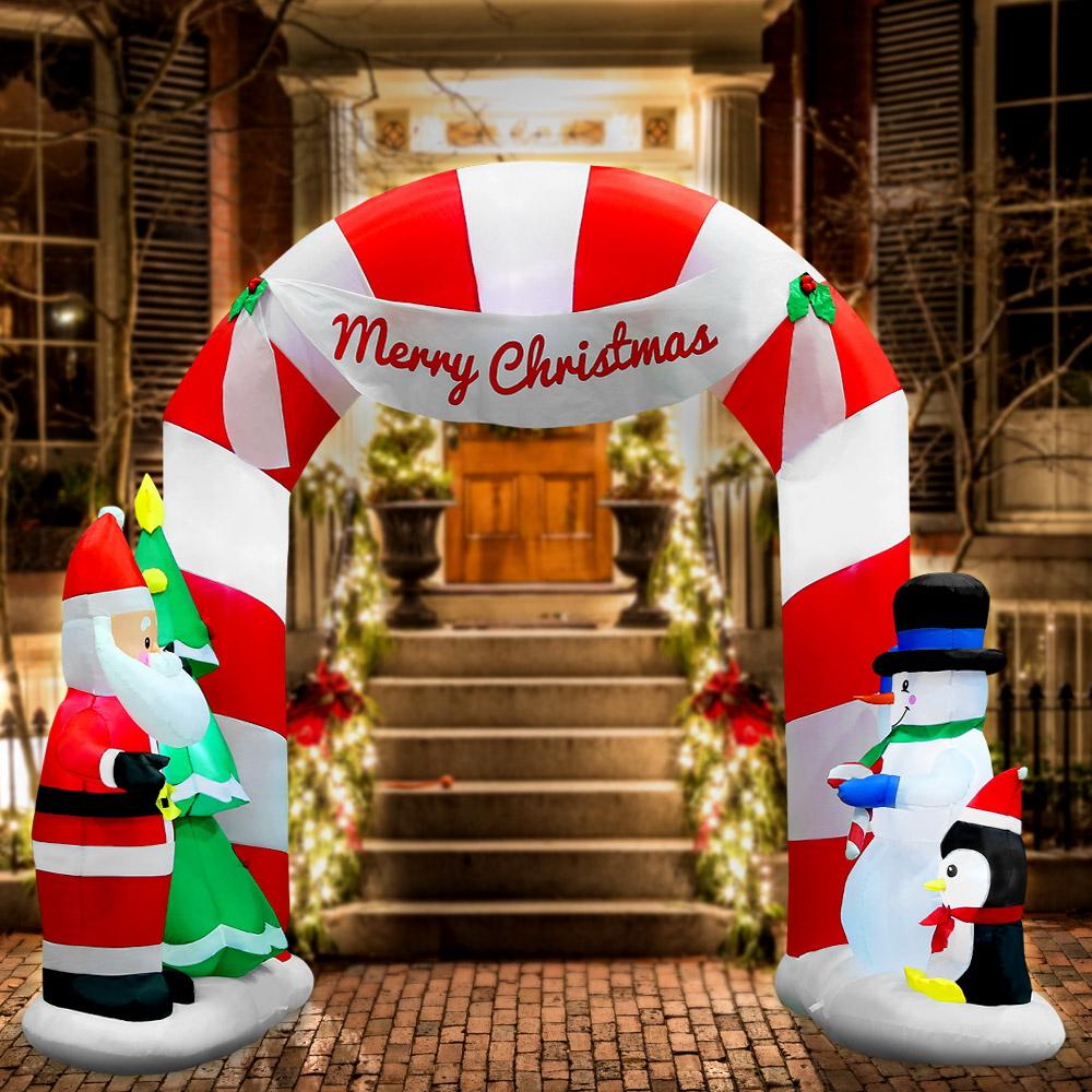 Jingle Jollys 3M Christmas Inflatable Archway featuring Santa, snowman, and penguin, illuminated with LED lights.