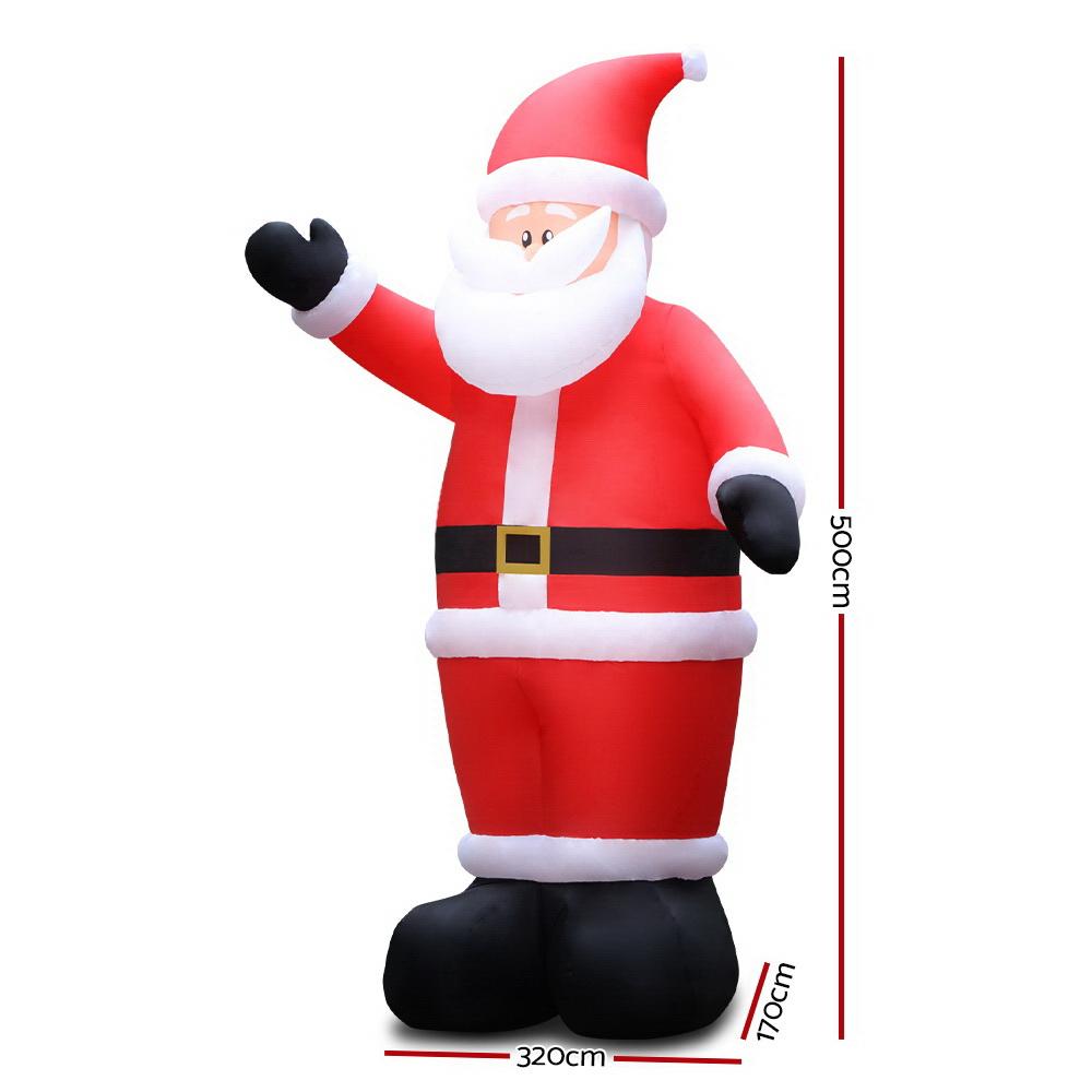 A 5-meter tall inflatable Santa Claus with LED lights, set up outdoors for Christmas decorations.