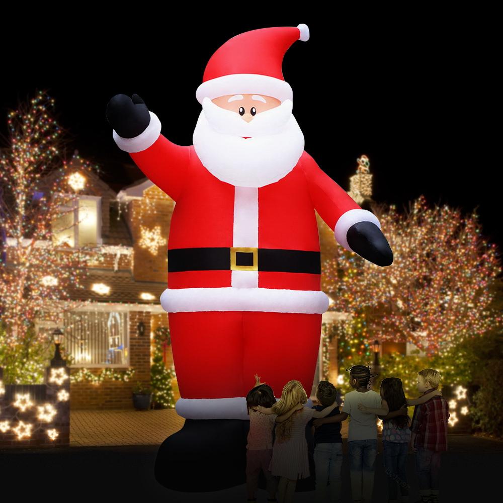 A 5-meter tall inflatable Santa Claus with LED lights, set up outdoors for Christmas decorations.