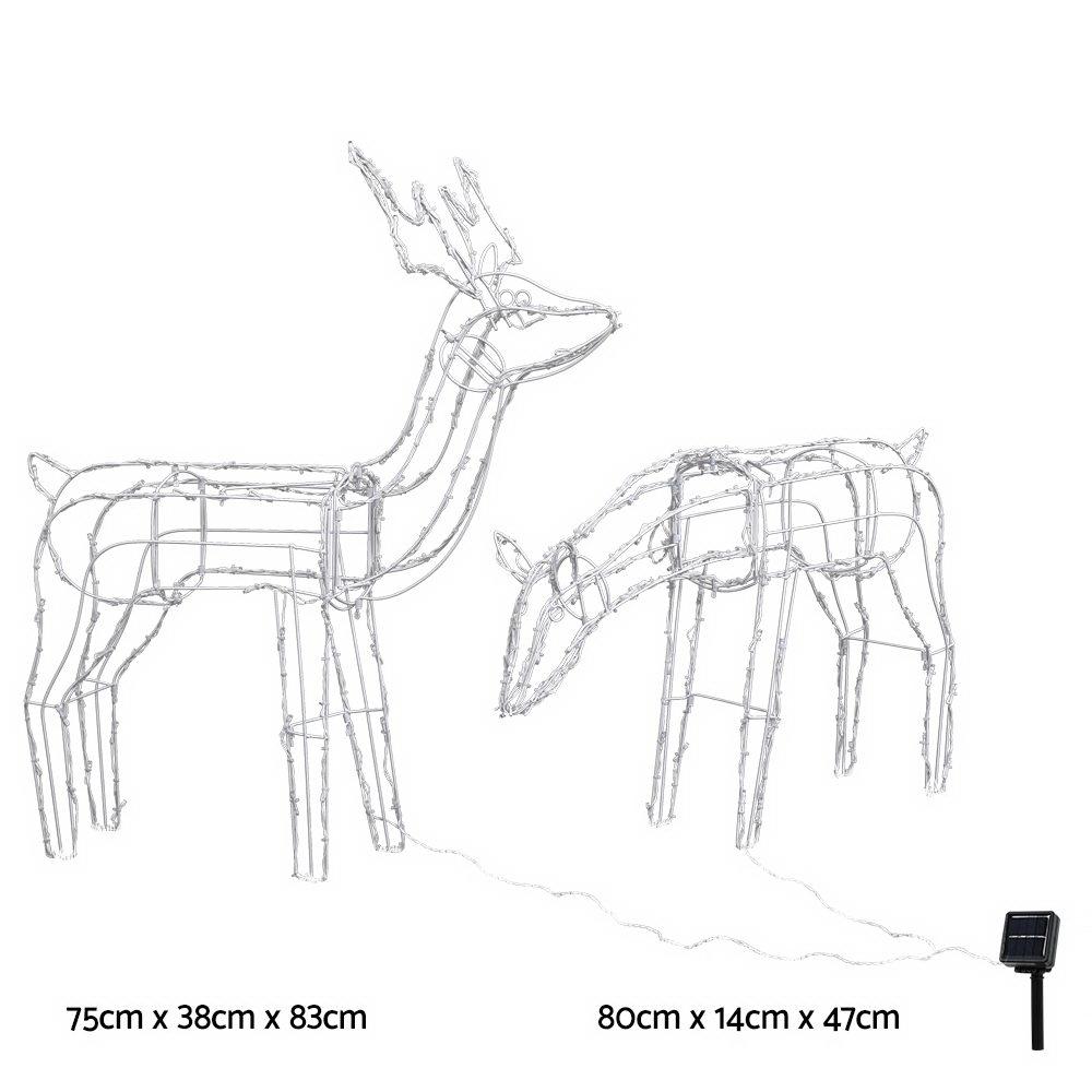 Two LED reindeer lights in feeding and standing positions, illuminated with bright LEDs, set against a snowy background.