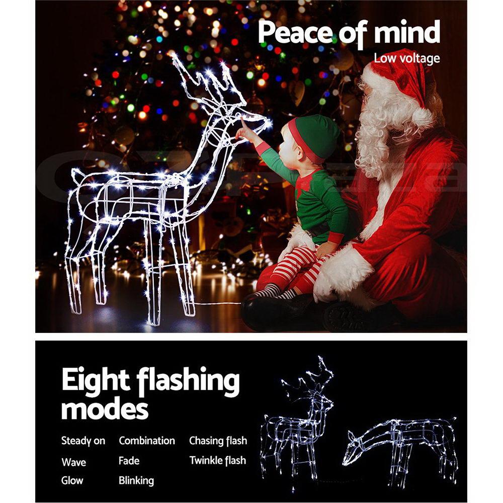 Two LED reindeer lights in feeding and standing positions, illuminated with bright LEDs, set against a snowy background.