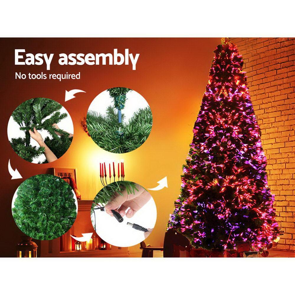 Jingle Jollys 1.8M LED Christmas tree with optic fibre lights, showcasing lush PVC tips and a sturdy metal stand, perfect for holiday decorations.