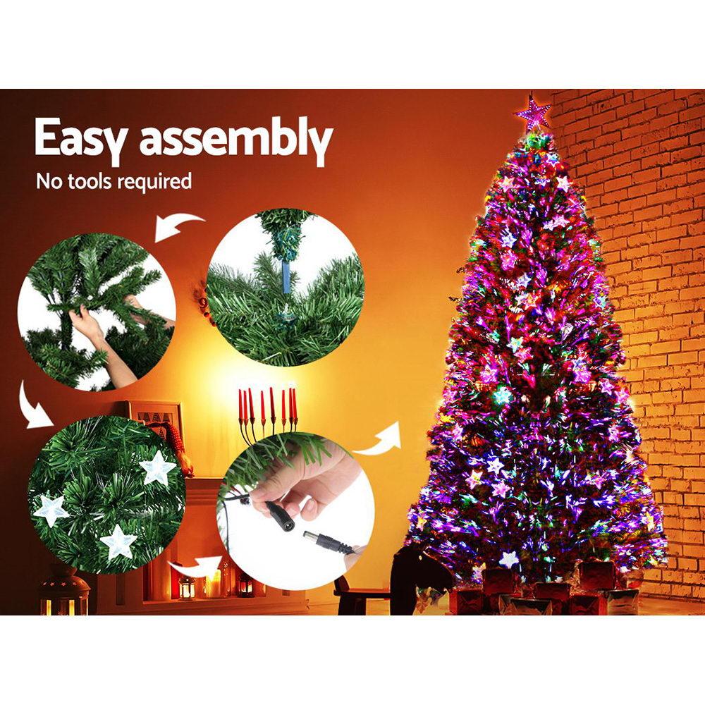 Jingle Jollys 1.8M LED Christmas Tree with colorful optic-fibre stars and a bright LED top star, showcasing a lush and realistic design.