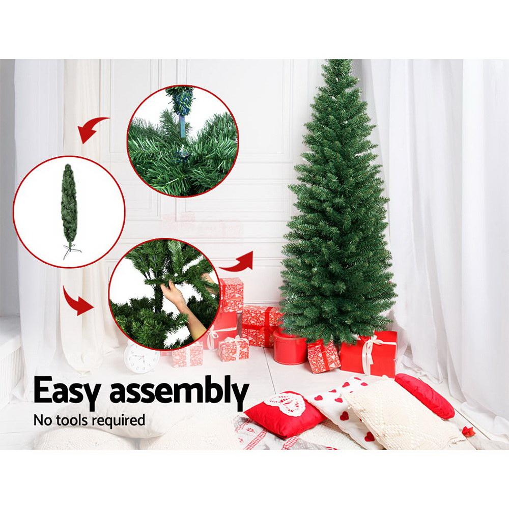 Jingle Jollys 1.8M Christmas Tree with 300 realistic PVC tips and sturdy metal stand, beautifully decorated for the festive season.