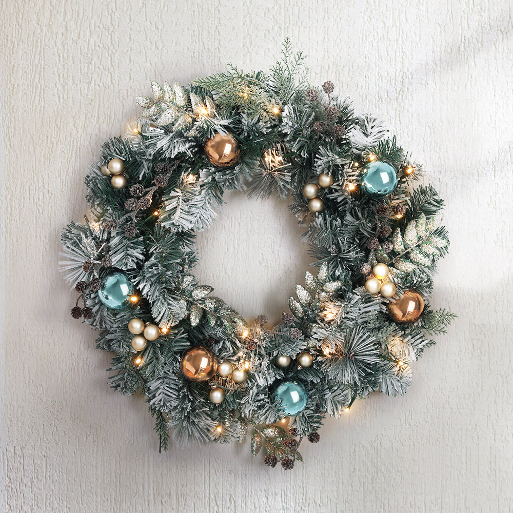 Jingle Jollys 60CM Christmas wreath with pre-lit warm LED lights, featuring thick foliage, pinecones, and decorative balls.