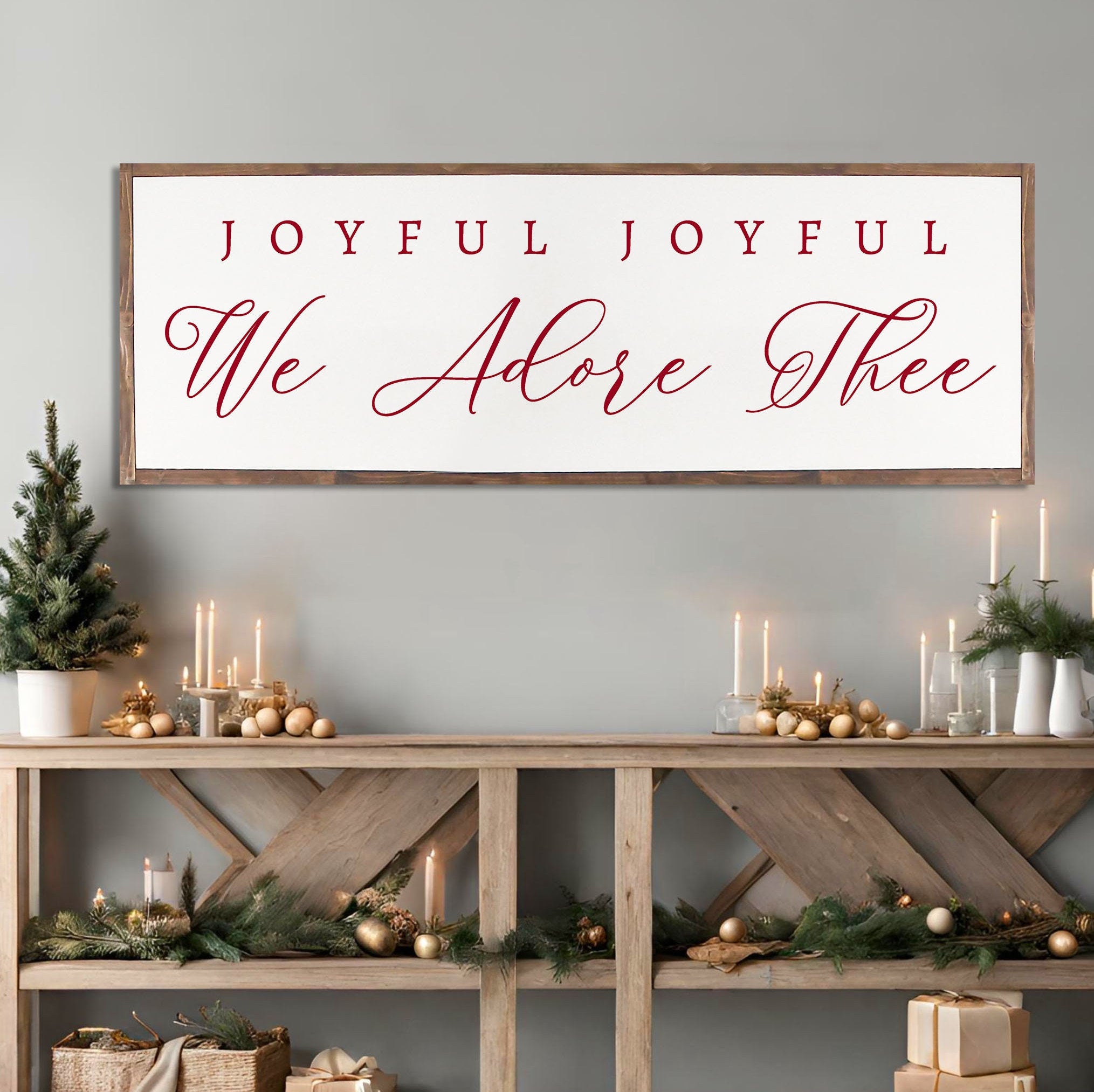 Rustic handmade Christmas wall art featuring the phrase 'Joyful Joyful We Adore Thee' on a dark walnut stained wooden background.