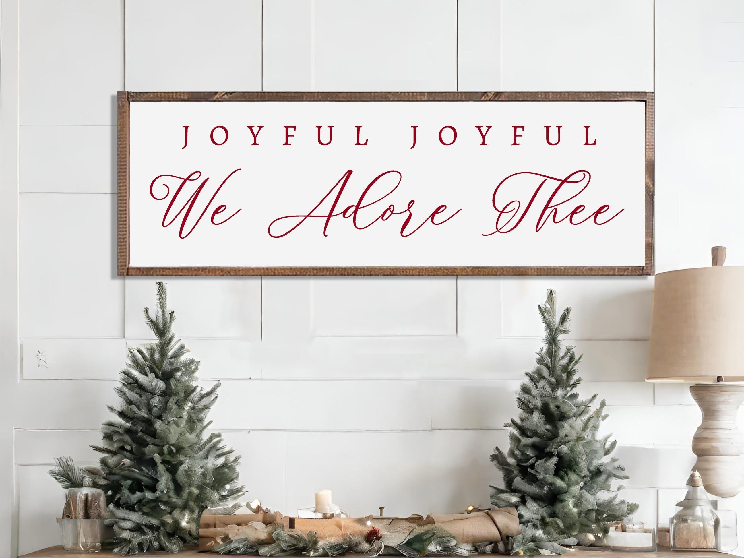 Rustic handmade Christmas wall art featuring the phrase 'Joyful Joyful We Adore Thee' on a dark walnut stained wooden background.