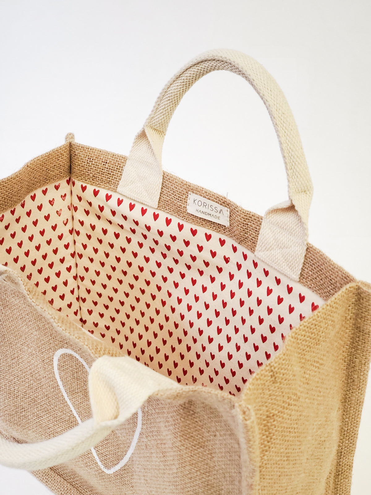 Jute Canvas Gift Bag with heart-patterned lining, showcasing a love motif, perfect for eco-friendly gifting.