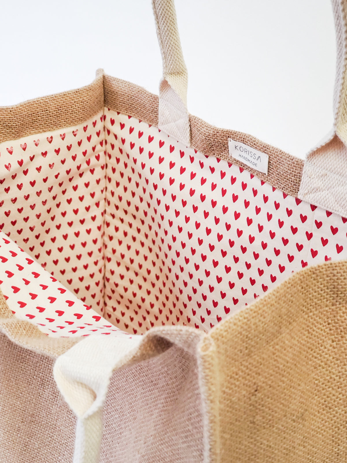 Jute Canvas Market Bag featuring a heart-patterned lining, eco-friendly design, and vibrant colors.