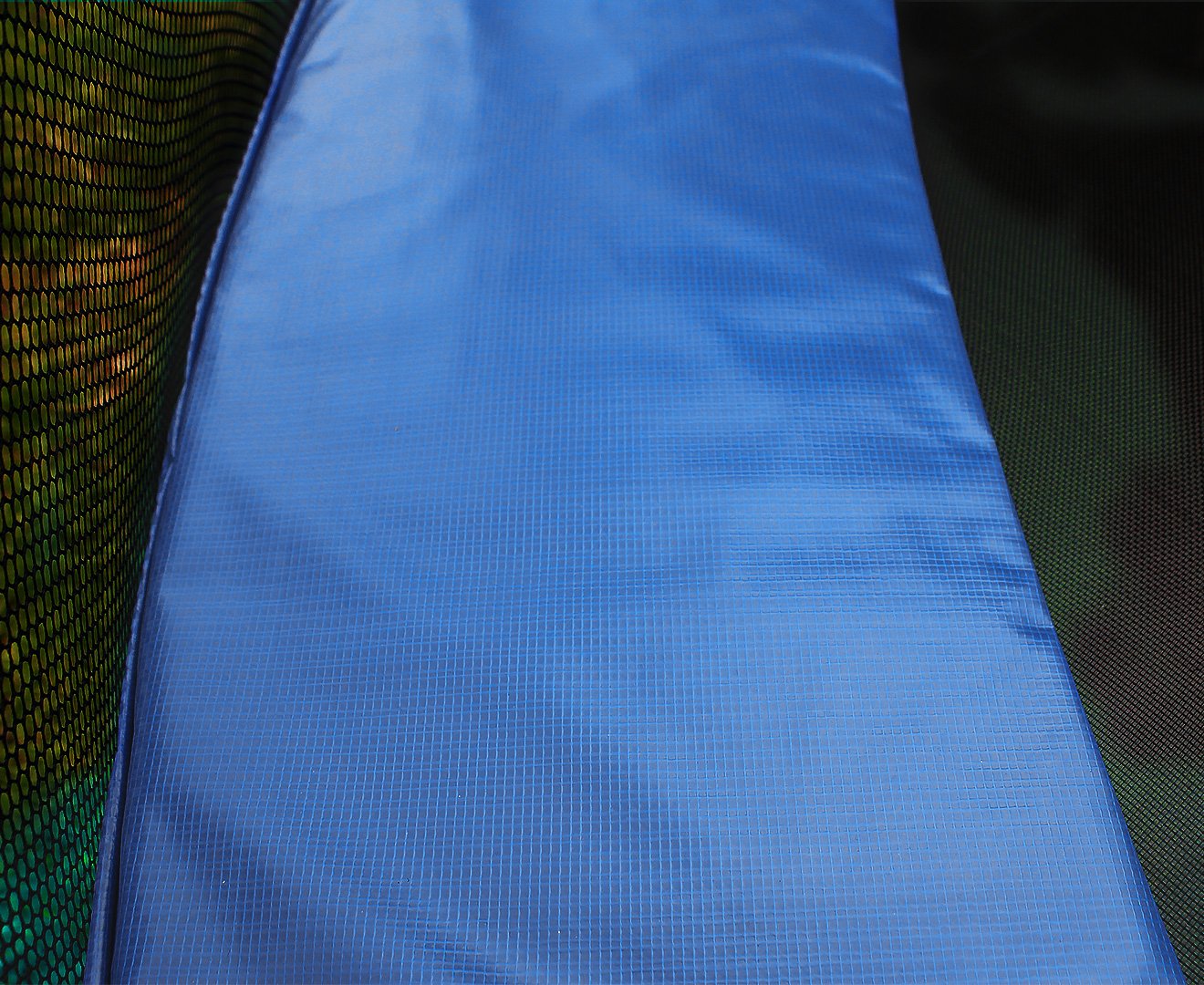 Kahuna 10ft round trampoline replacement pad in blue, featuring a durable PVC exterior and nylon mesh reinforcement.