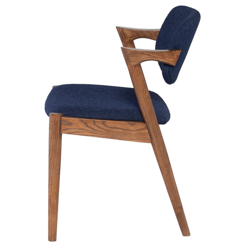 Kalli Dining Chair in True Blue with stained Ash legs and lightly padded seat, showcasing contemporary design and traditional charm.