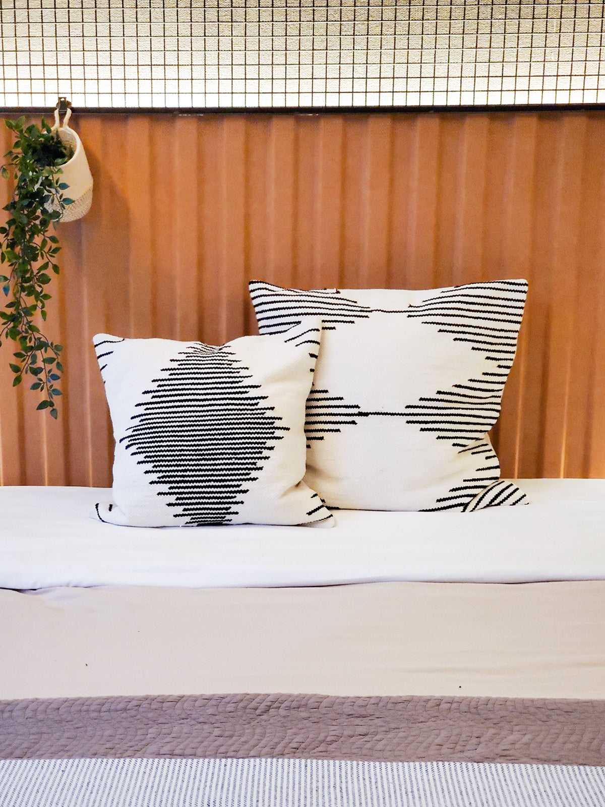 Kalo Pillow Cover made from recycled chenille scraps, featuring a soft texture and neutral black and white design, perfect for home decor.