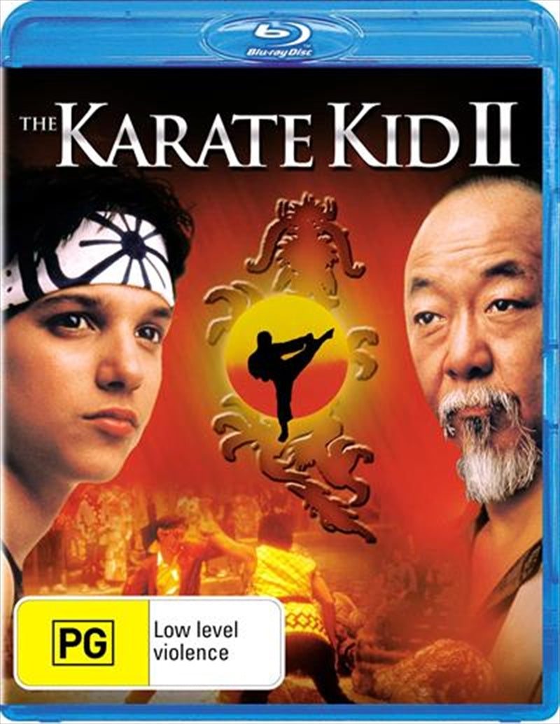 Blu-ray cover of Karate Kid II featuring Daniel and Mr. Miyagi in a scenic Okinawa setting.