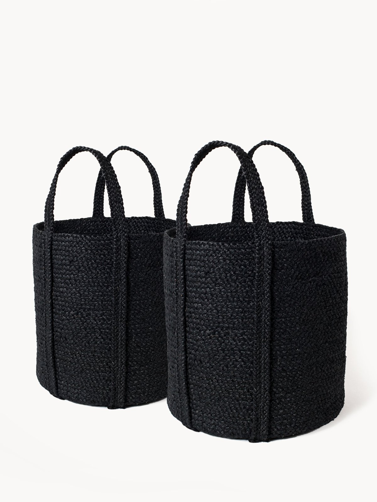 Kata Basket with handle in black, made from braided jute, showcasing its unique texture and design.