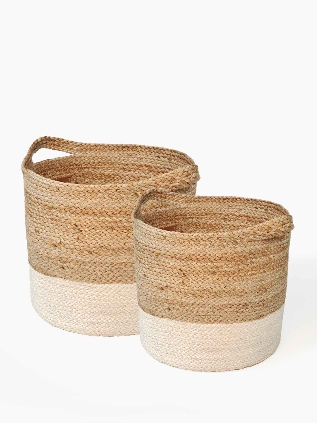 Kata Colorblock basket made from braided jute, featuring a natural and white color scheme, ideal for home storage.