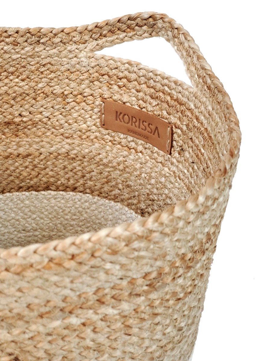 Kata Colorblock basket made from braided jute, featuring a natural and white color scheme, ideal for home storage.