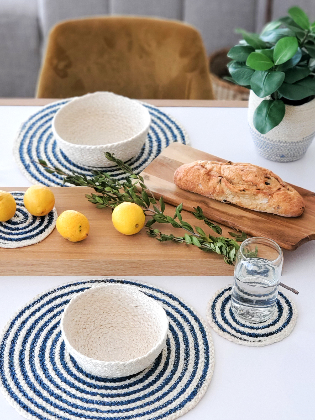 Set of four blue and white round jute placemats, beautifully braided and handcrafted.