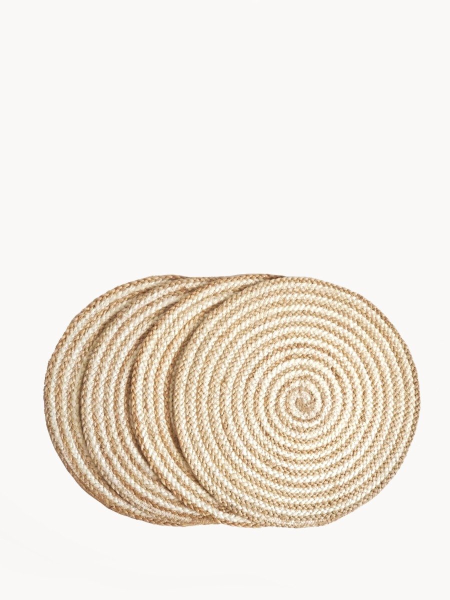 Set of 4 natural jute round placemats with braided texture, perfect for dining tables.